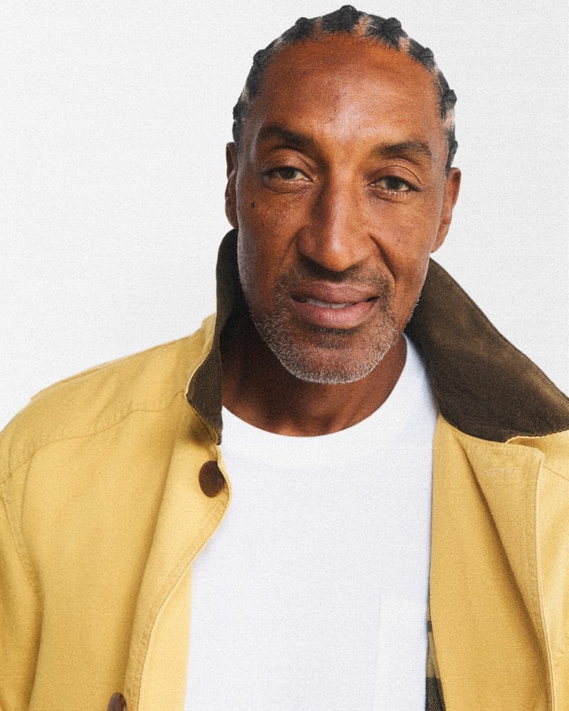 Scottie Pippen in a yellow J.Crew Barn Jacket with a brown corduroy collar over a crewneck tee