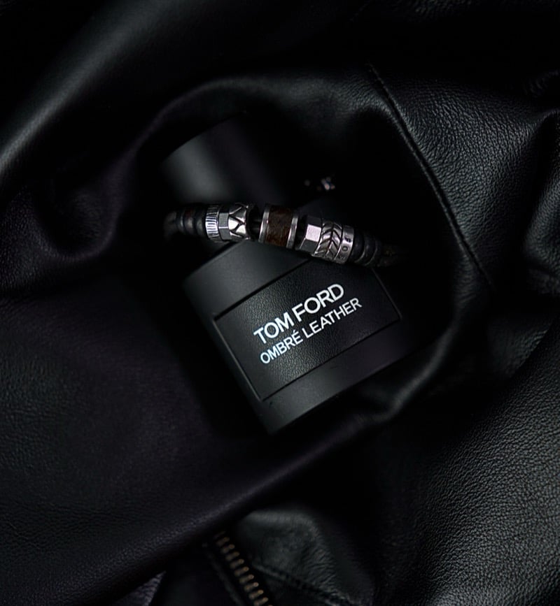 Tom Ford Ombré Leather bottle with a beaded bracelet on black leather