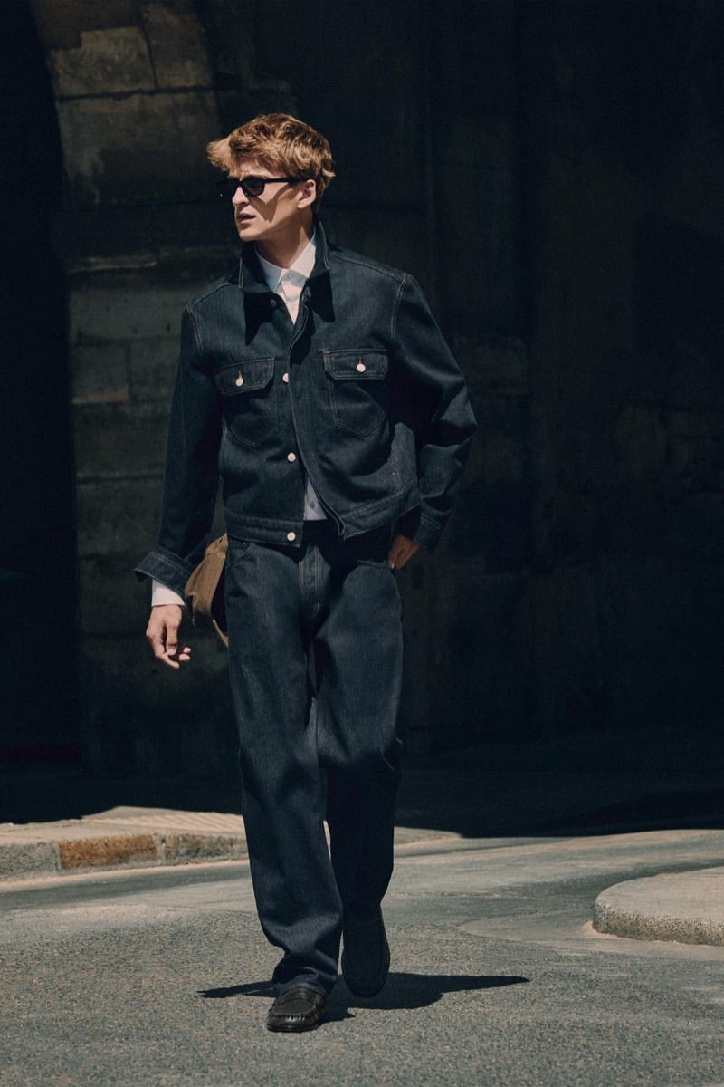 Vasko Luyckx in sunglasses, wearing a denim jacket and matching jeans for Zara's 90's Archive