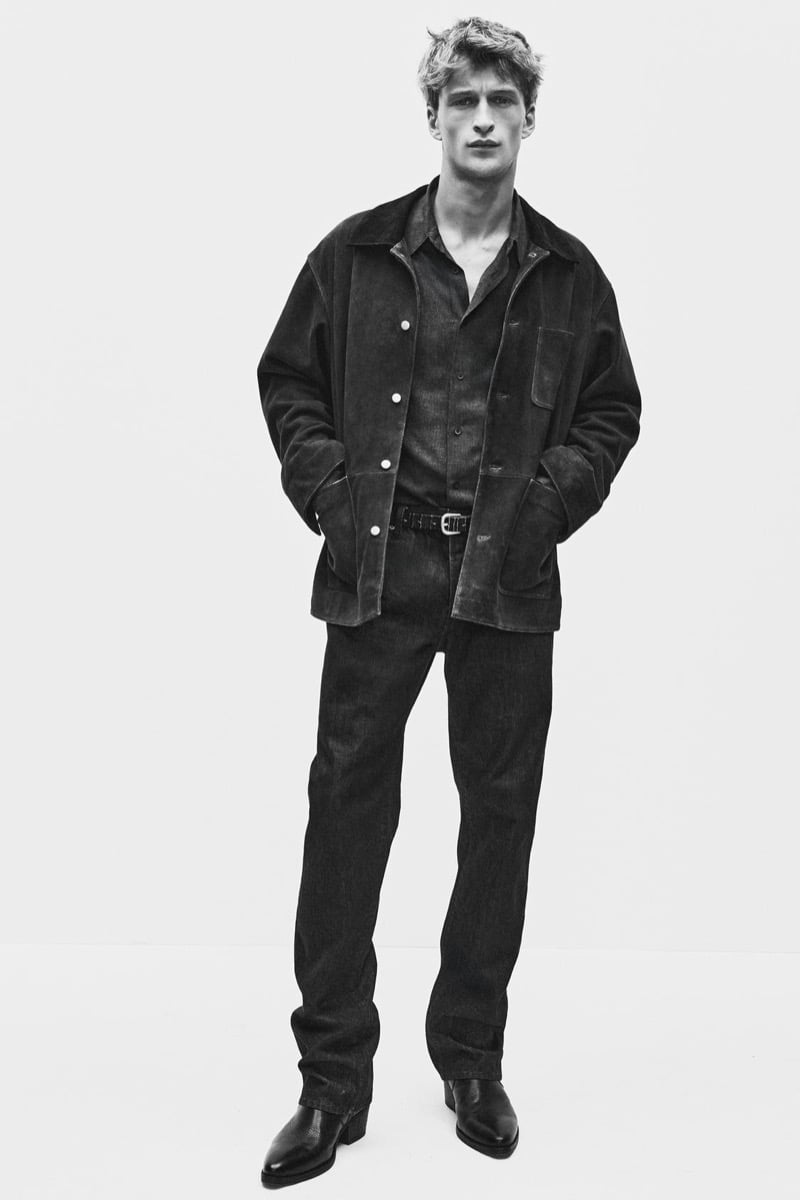 Vasko Luyckx in a suede-look chore jacket over a collared shirt and straight trousers for Zara's 90's Archive
