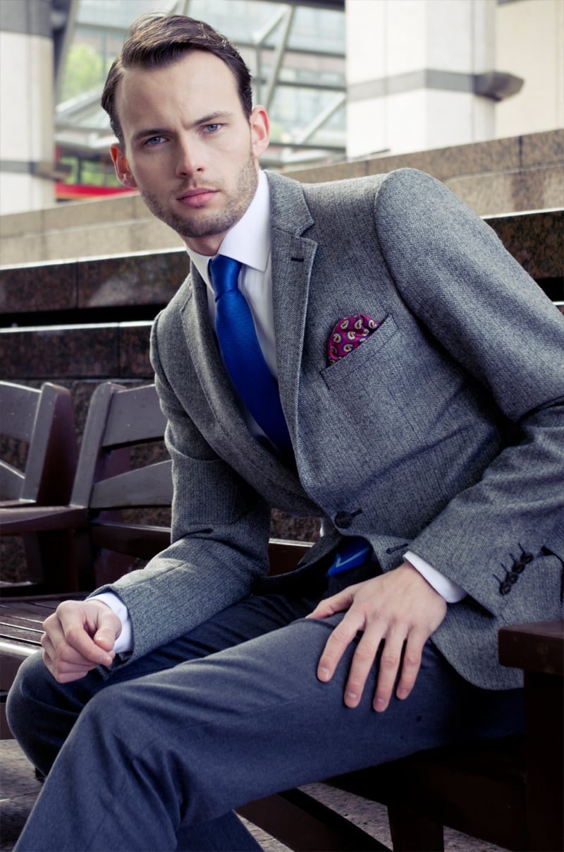 Chay Morris wears a Zara suit with a blue tie and patterned pocket square.