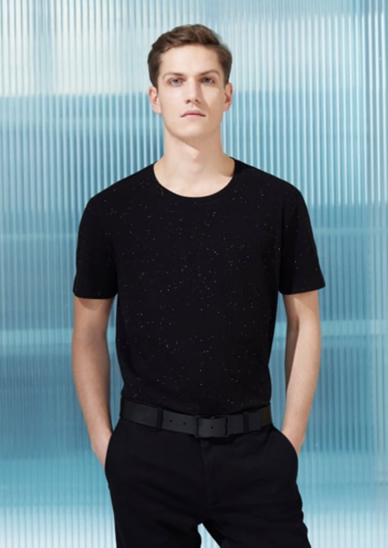 Peter Bruder wears a black T-shirt and trousers for COS in 2014.