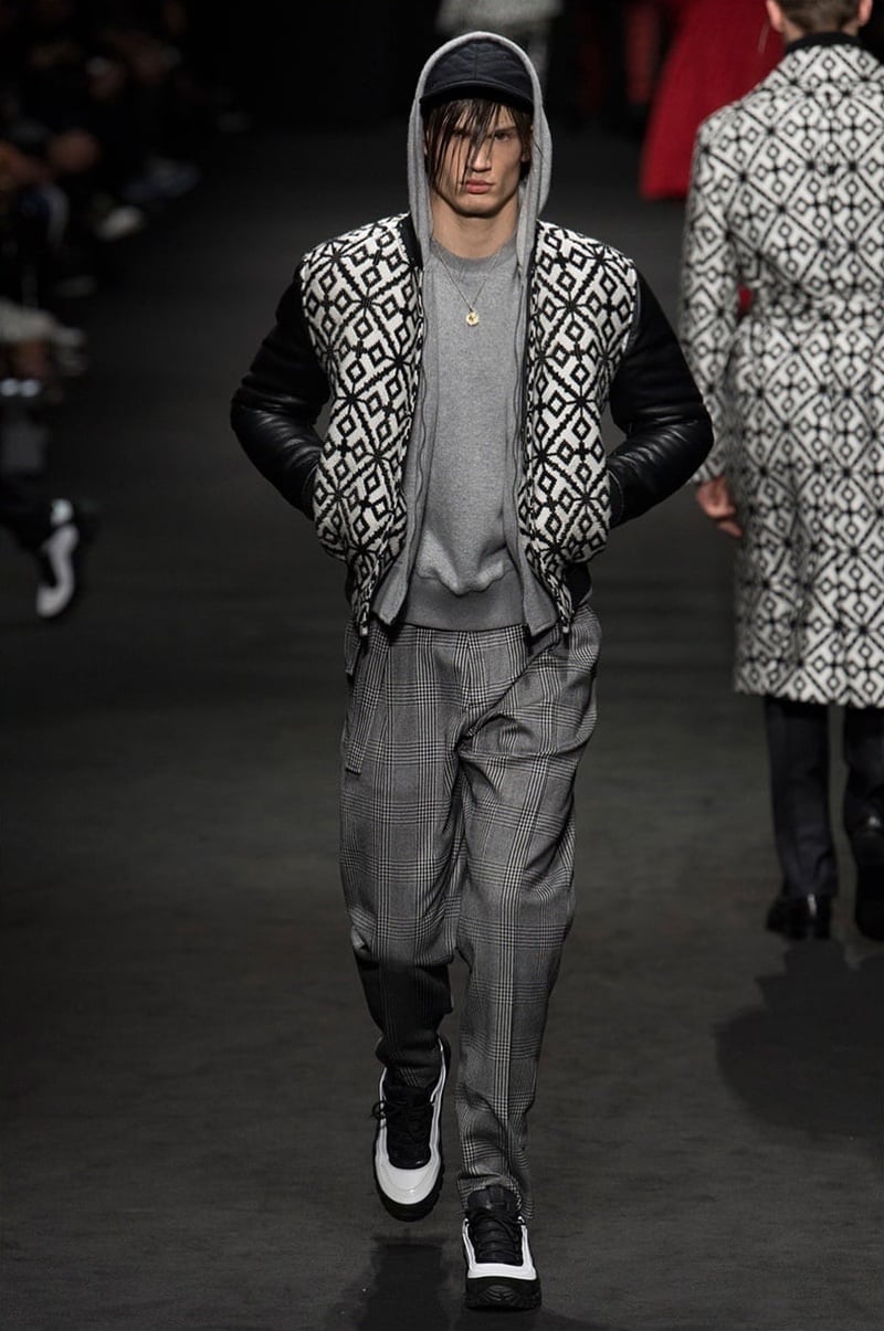 Versace fall 2017 geometric jacket over a hoodie with checked trousers and sneakers.