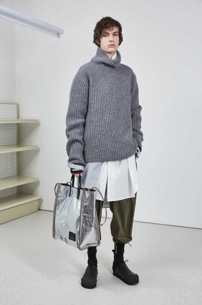 3.1 Phillip Lim fall 2018 gray knitwear layered over long white shirting and cropped trousers.