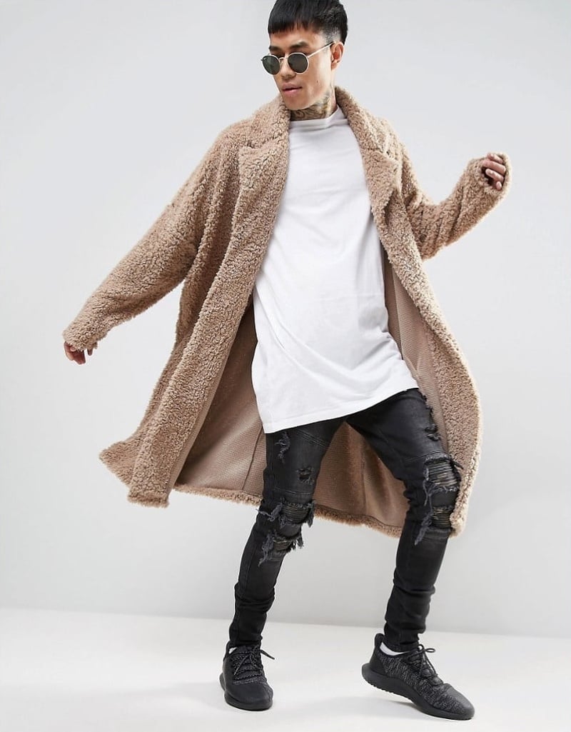 ASOS oversized beige borg duster coat with a white T-shirt and ripped black skinny jeans in 2017.