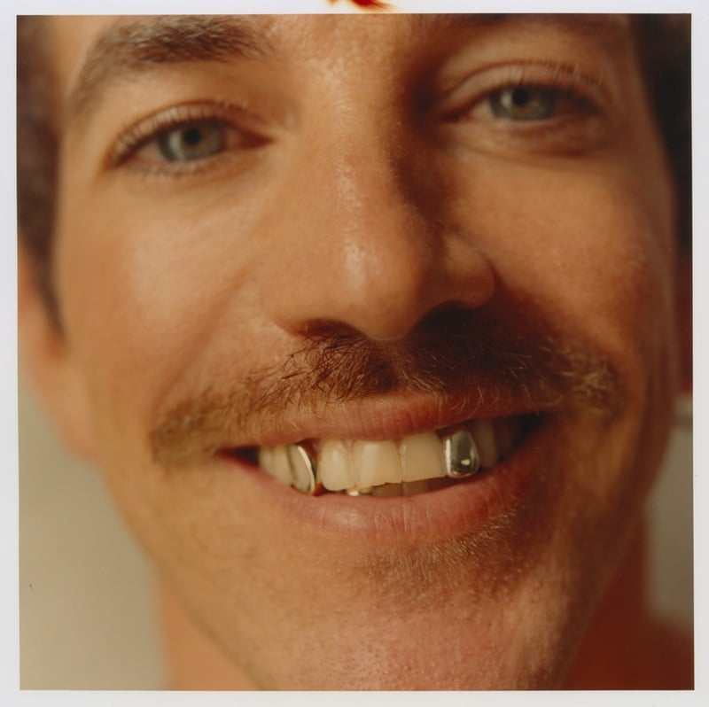 Close-up of Alex Fine smiling at the camera.
