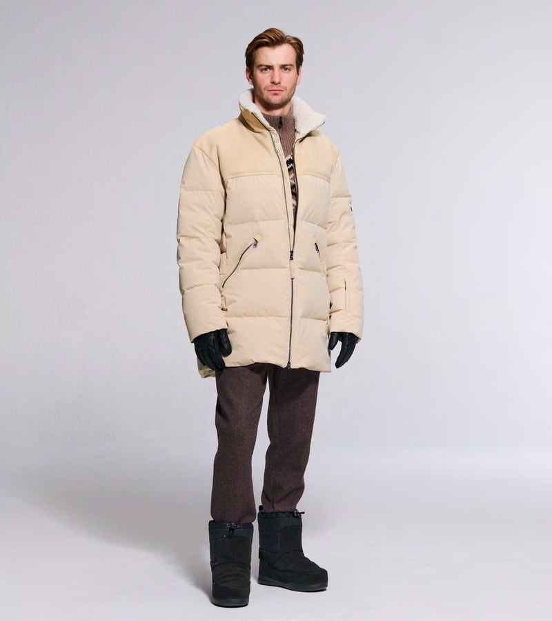 Ben Allen wears a cream padded jacket with brown trousers and black boots. Bogner fall-winter 2026 collection.