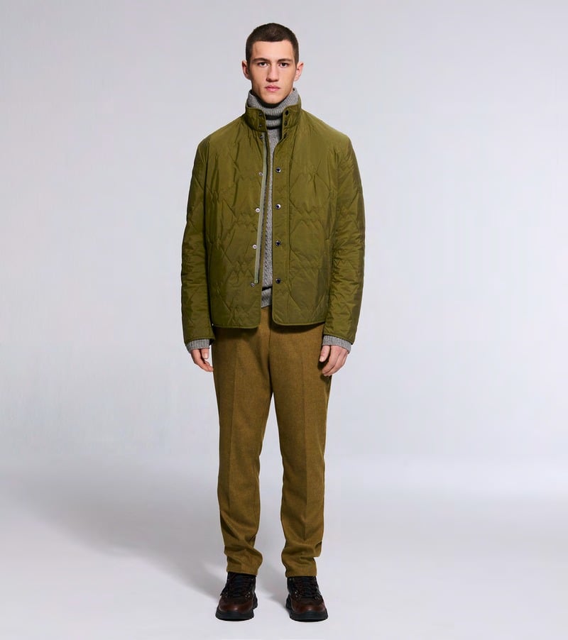 A model wears an olive quilted jacket with coordinating trousers and dark shoes. Bogner fall-winter 2026 collection.