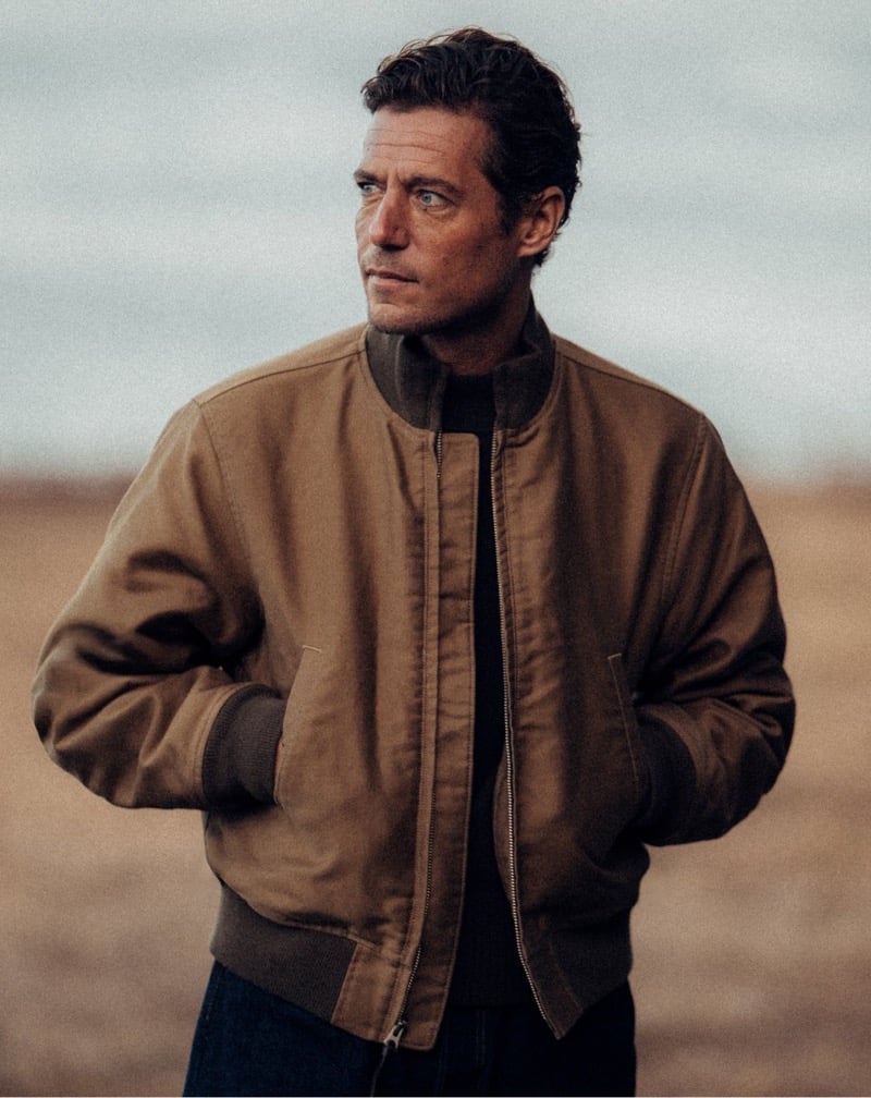 Jon Paul Phillips wears a bomber jacket over a corduroy shirt.