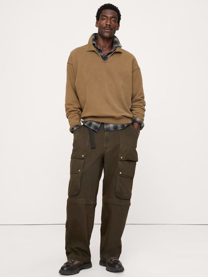 Tan collared sweatshirt over a checked shirt, convertible cargo pants and leather lace-up shoes from Banana Republic.
