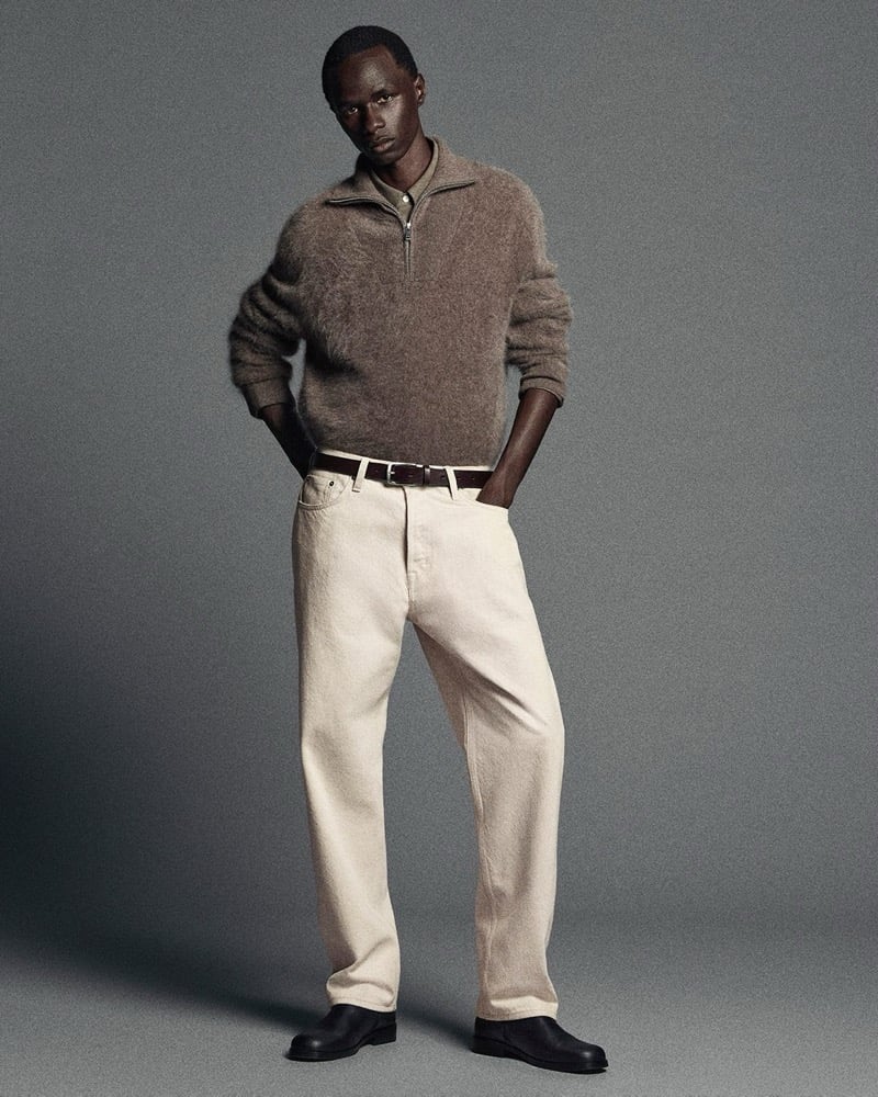 malick bodian wears a cashmere zip sweater with ecru jeans