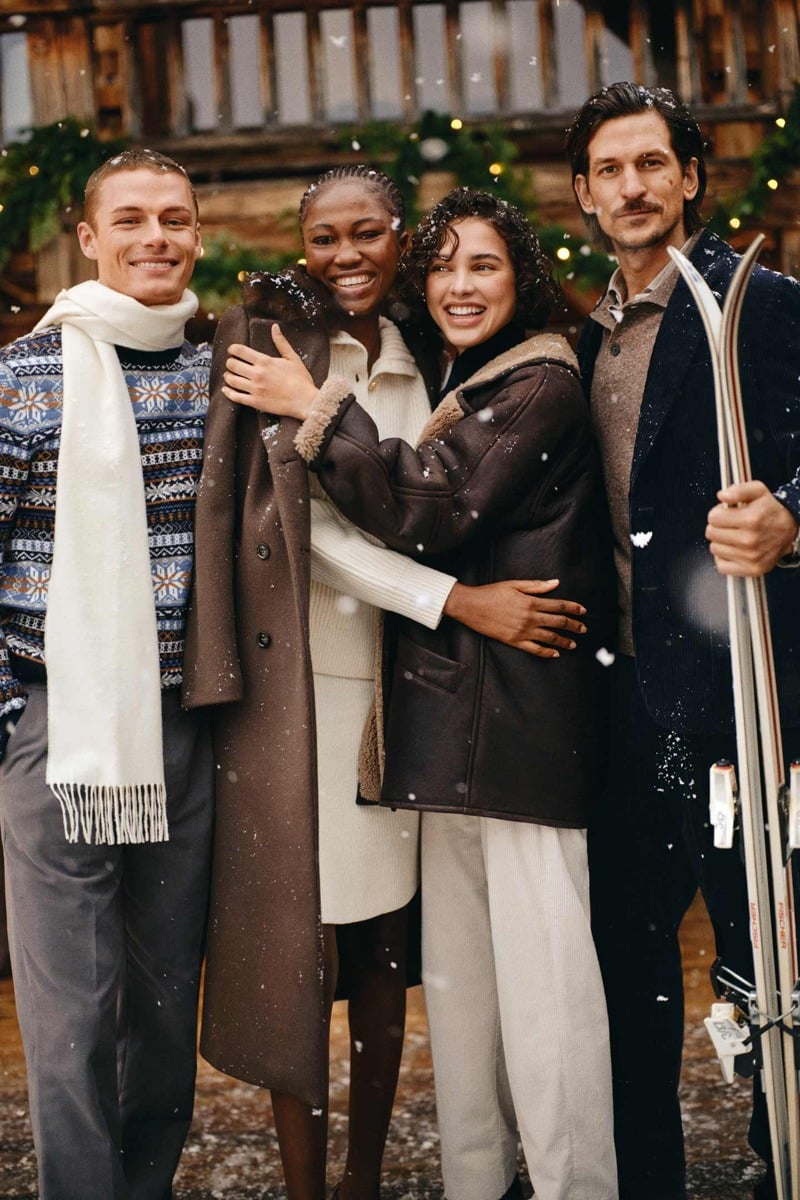 Finley Prentice and Jarrod Scott join friends outside a snowy lodge wearing Gant knitwear and winter tailoring.