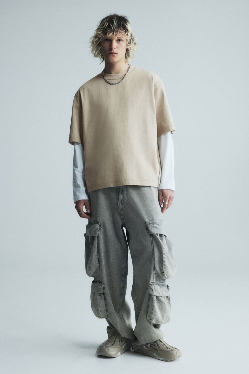 Daniil Kercz wears layered tees and baggy cargo jeans in H&M’s 2024 skater edit.