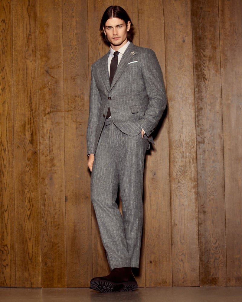 Harrison Page wears a gray pinstripe suit with a white shirt and dark tie for JOOP!.
