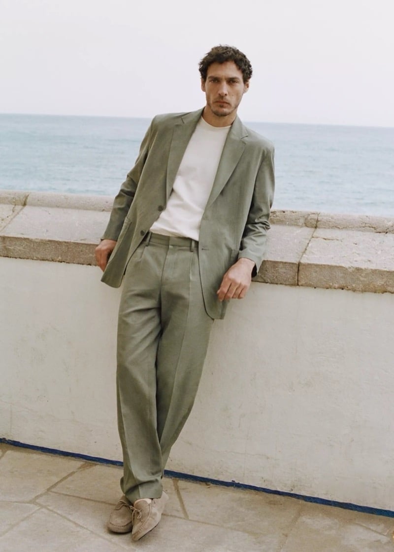 Pierre-Benoit Talbourdet wears Mango’s spring 2026 suit with a white tee and suede shoes.