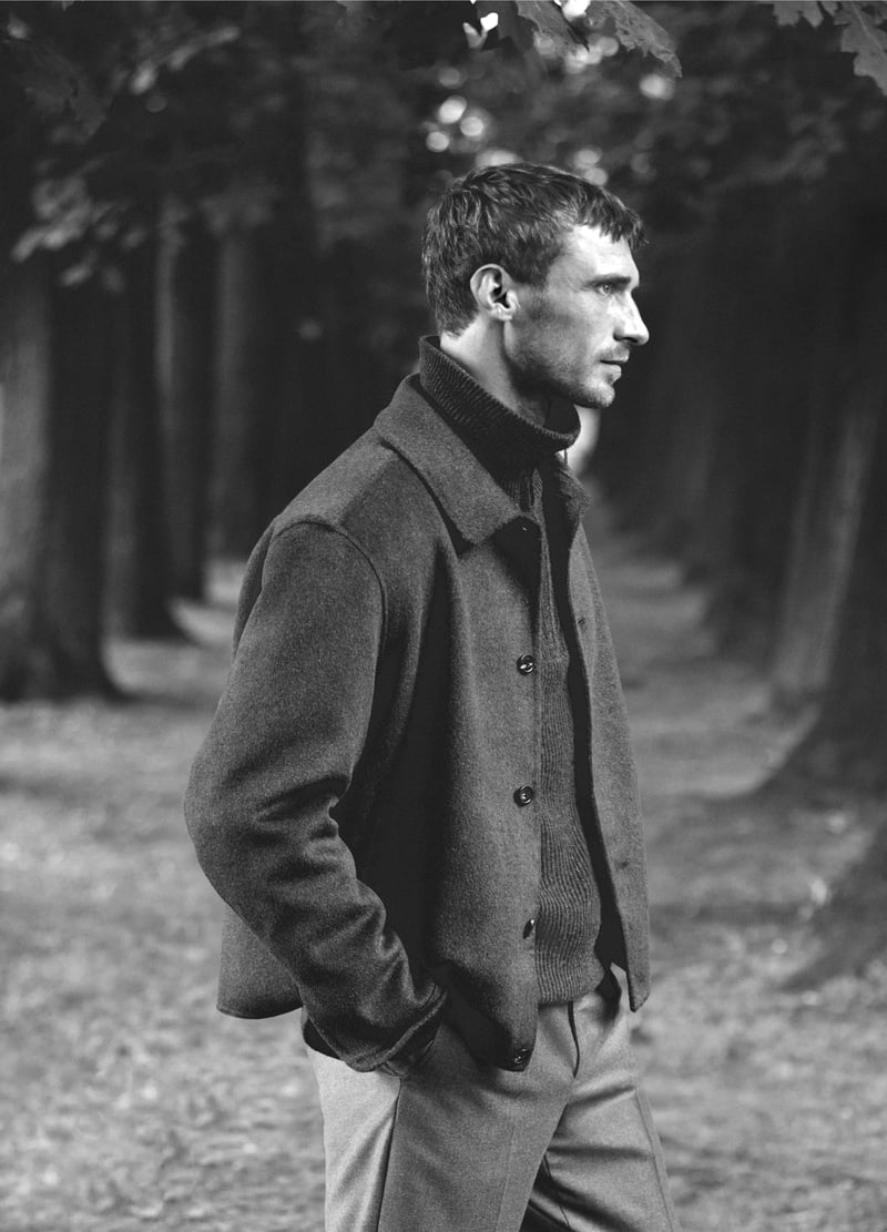 Clément Chabernaud wears a button-front jacket outdoors in a black-and-white photograph.