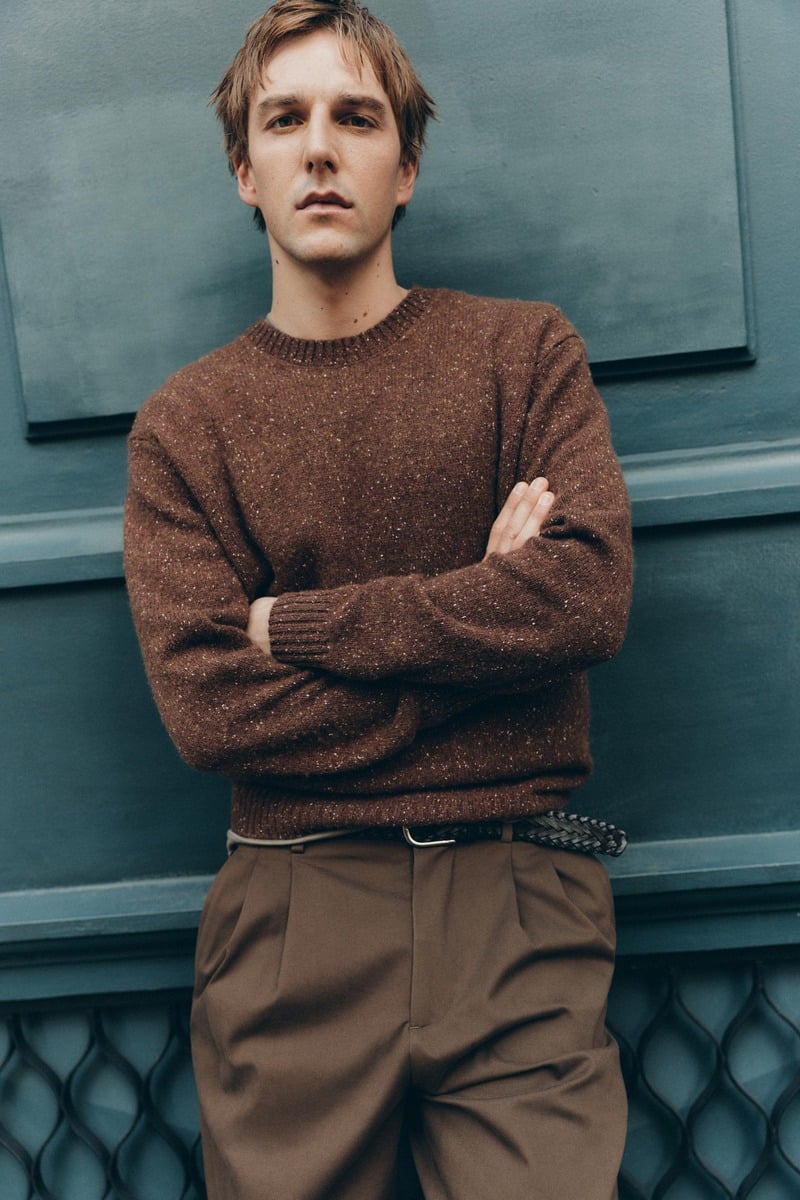 Quentin Demeester wears a textured brown sweater tucked into belted trousers for Massimo Dutti's fall 2026 New York edit.