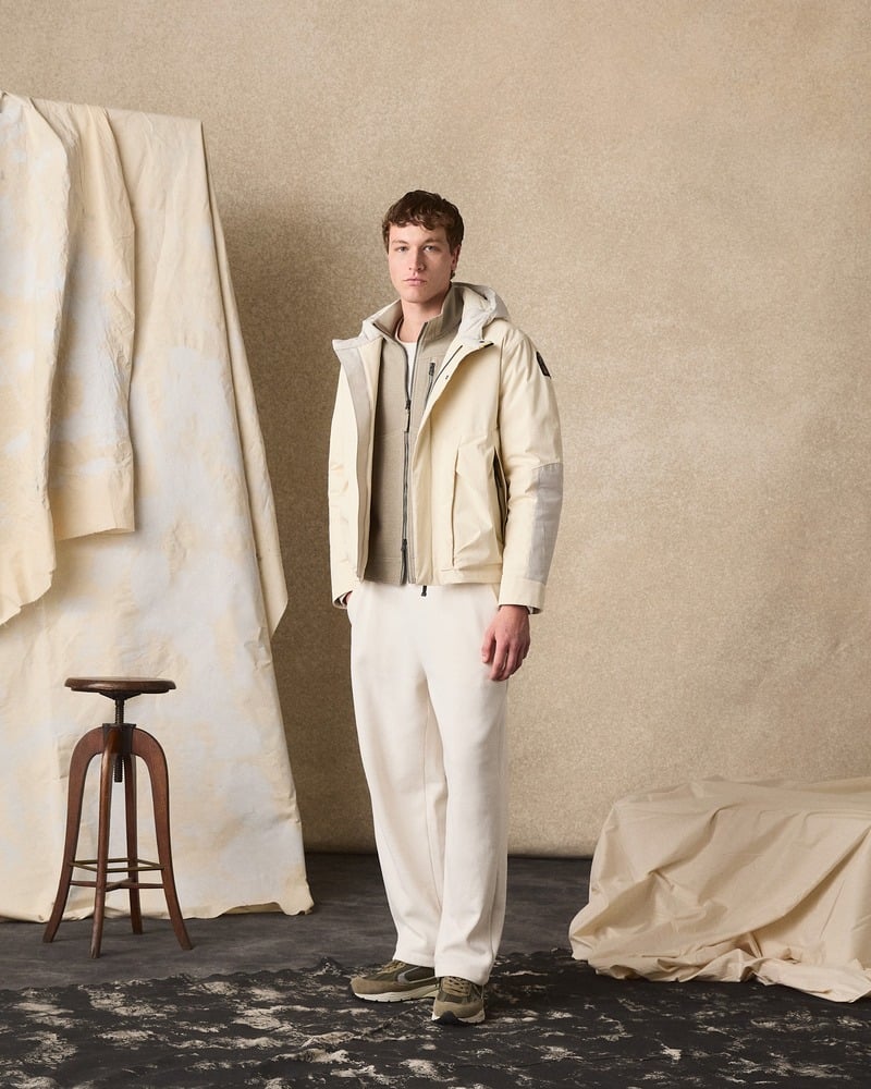 Model wears a pale Parajumpers jacket with white trousers in the fall-winter 2026 lookbook.
