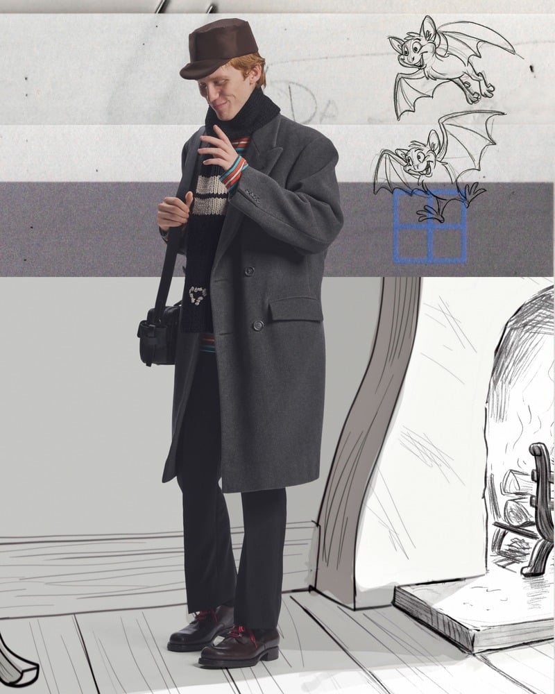 Luther Ford wears a long gray coat, hat, and scarf against animal sketches behind the scenes of Prada's holiday 2026 campaign.