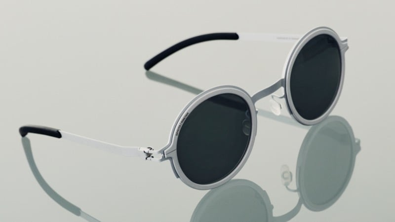 RIMOWA x MYKITA Heritage MR007 sunglasses feature circular silver frames and dark lenses.