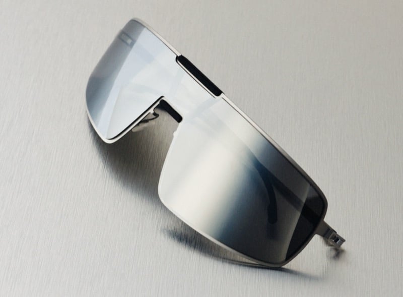 RIMOWA x MYKITA Visor MR008 sunglasses feature a mirrored wraparound shield and slim temples.