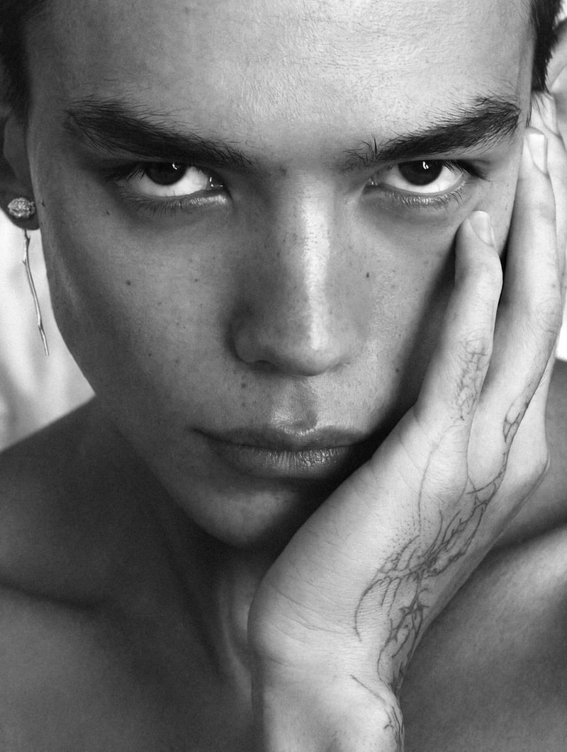 Sasha Profatilov wears an Alan Crocetti earring in a close-up portrait.