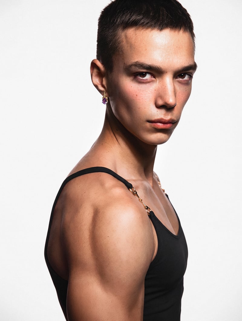 Sasha Profatilov wears a Gucci top and an Alan Crocetti earring.