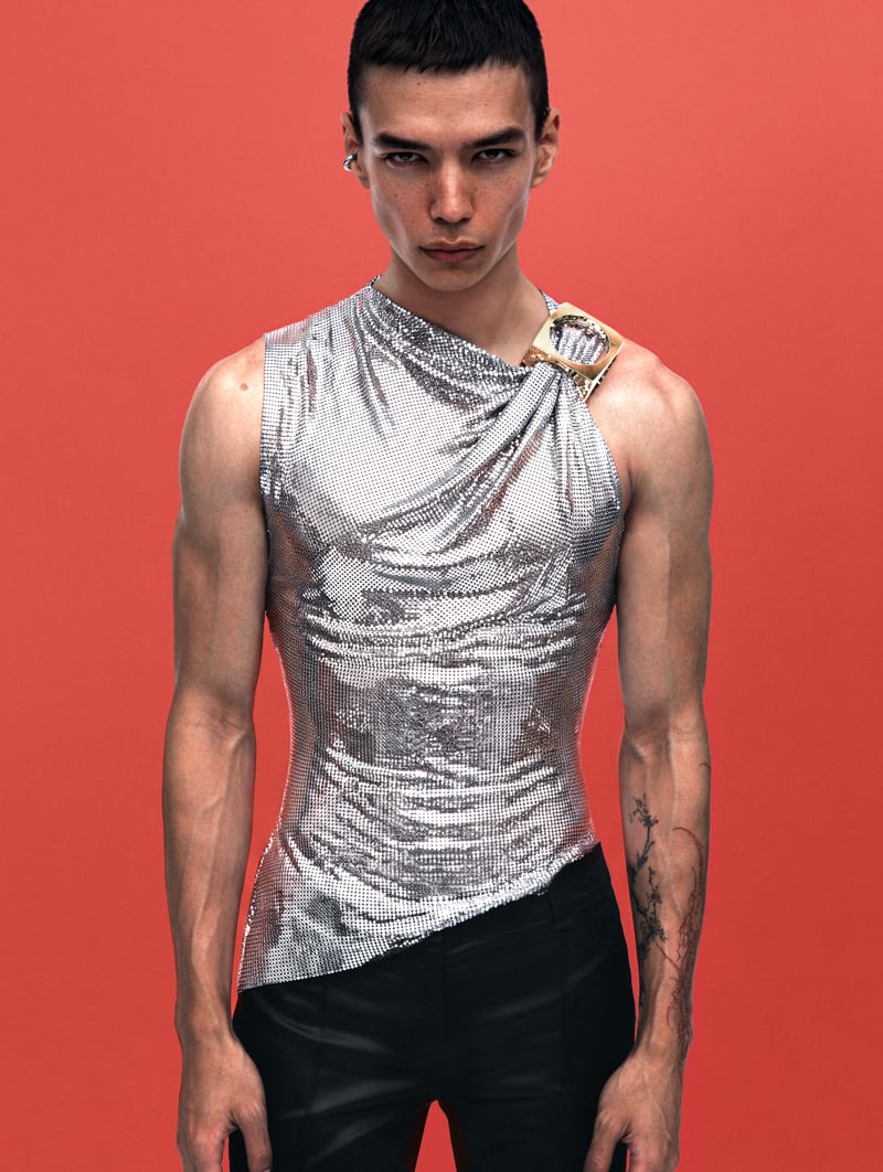 Sasha Profatilov wears a Rabanne top, Gucci trousers, and a Panconesi ear cuff.