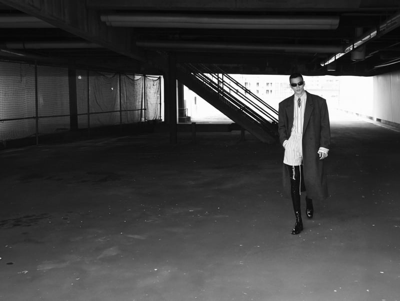 Sasha Profatilov wears Saint Laurent by Anthony Vaccarello in a concrete parking structure.