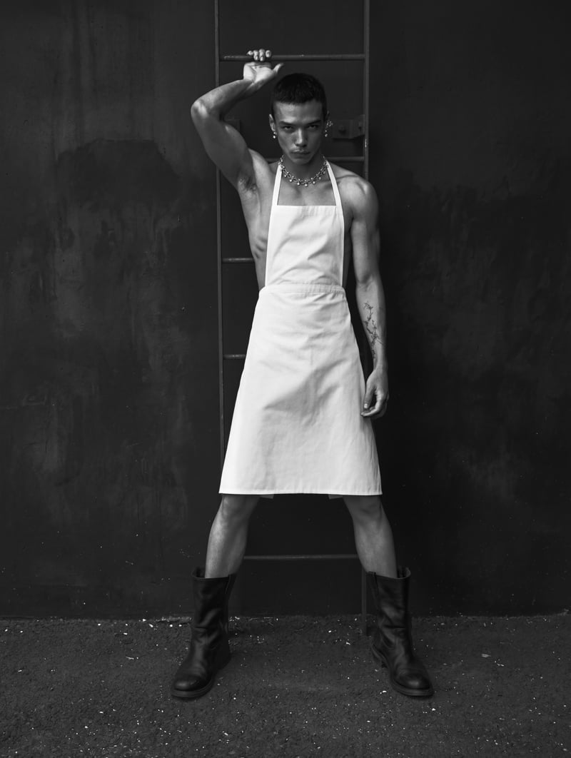 Sasha Profatilov wears a Miu Miu apron and boots with Panconesi jewelry.