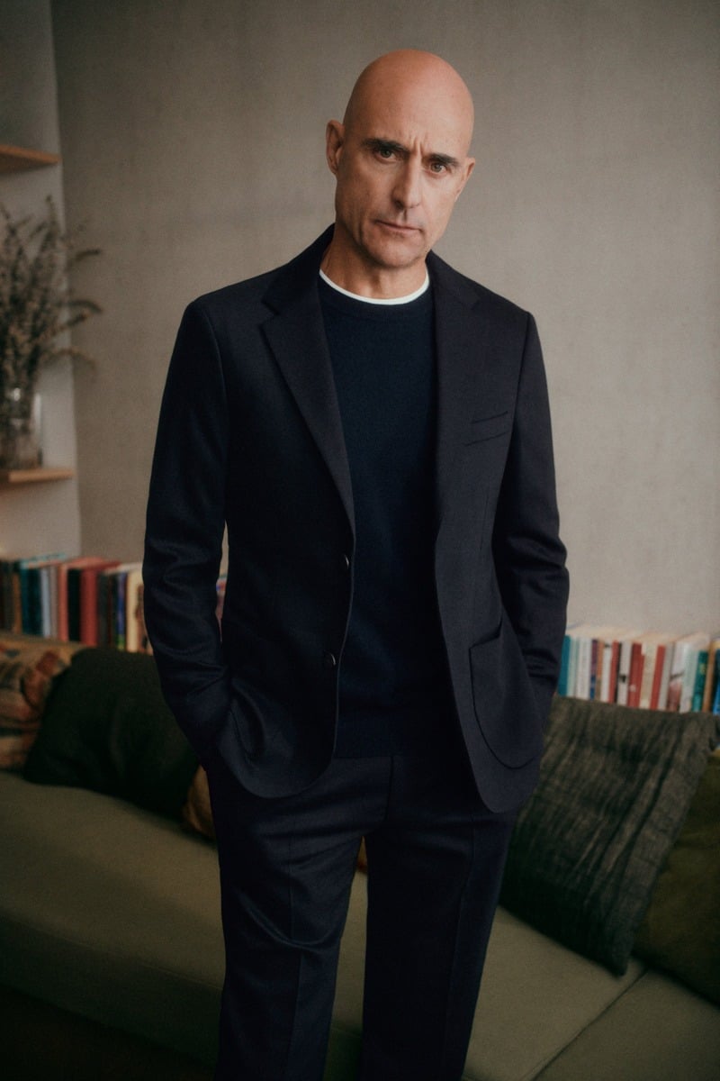 Mark Strong wears a dark blazer over a crewneck sweater for Sunspel’s fall-winter 2026 campaign.