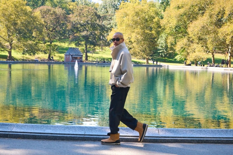 Dao-Yi Chow walks through Central Park in chestnut UGG Classic Mini Guard GTX boots for the GTX campaign.