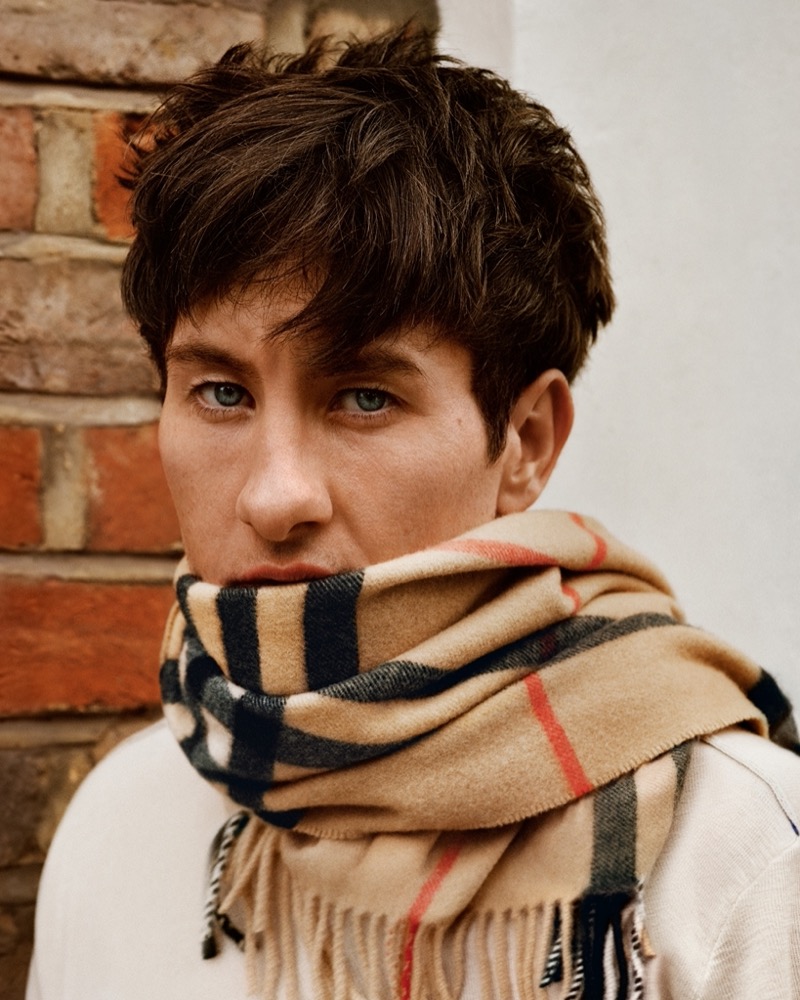 Barry Keoghan wears Burberry’s check cashmere scarf in archive beige.